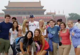 A group of young students gathered together.