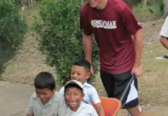 Volunteer playing with local kids 