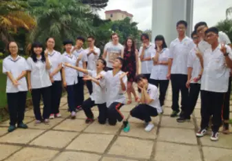 A group of young students gathered together.