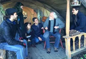 john callen with students in hobbiton