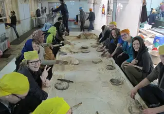 Making Chapati for worshippers at a temple in Delhi.