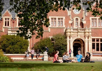 students sitting on lawn