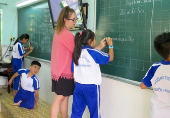 English teacher in Vietnam in front of class