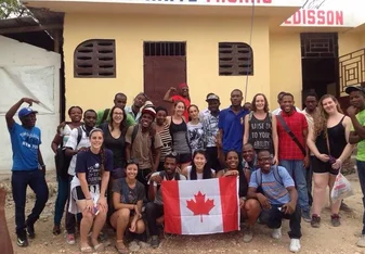 Group of volunteers in front of building