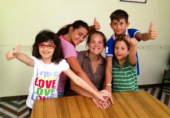 Volunteer playing with the children in Italy