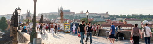 A street in France with tourists walking along the path