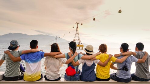 Friends gazing outwards to sea