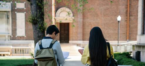 Two college students walking together