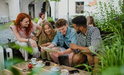 Friends drinking coffee together via unsplash