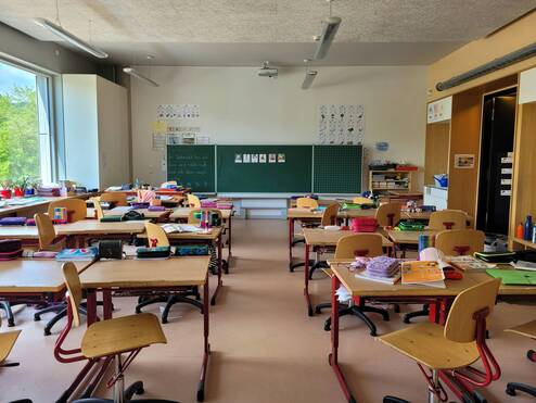 Classroom with desks and chalkboard