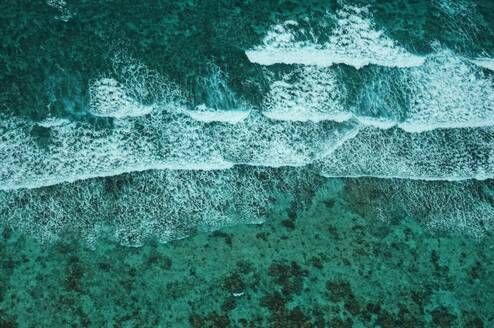 An aerial view of the ocean and tides in Belize