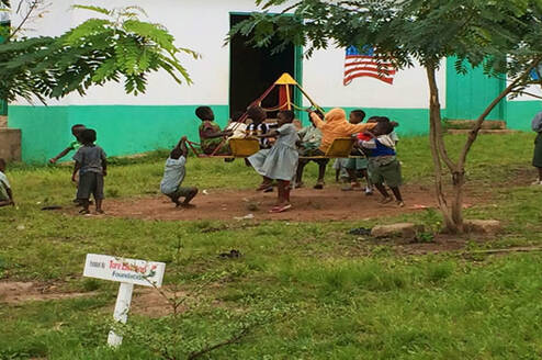 children in Ghana playing on playground