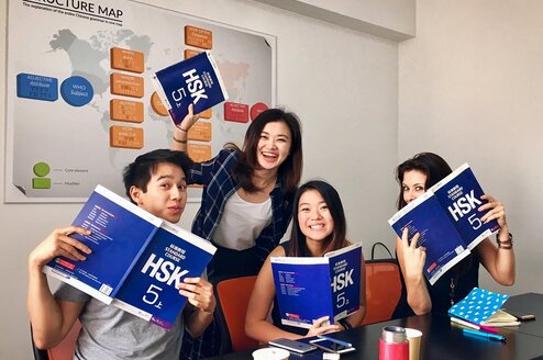 Pictures intensive courses smiling-students-with-books-during-intensive-group-class