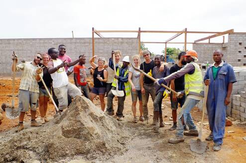 Volunteers on the Rising Education Centre site