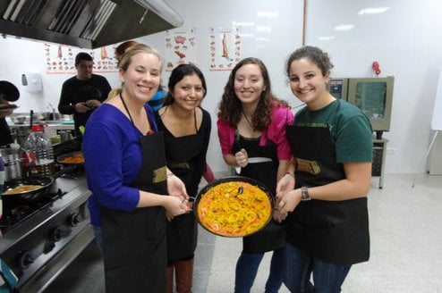 IES Abroad Salamanca students cooking a traditional Spanish dish 