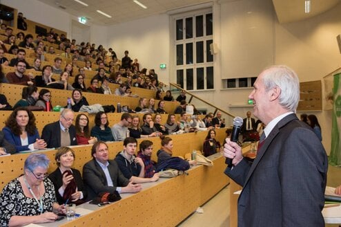 Old man telling something in the stage