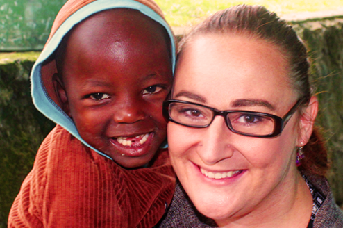 Child and Volunteer Smiling 