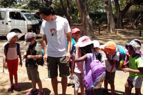 intern with school children