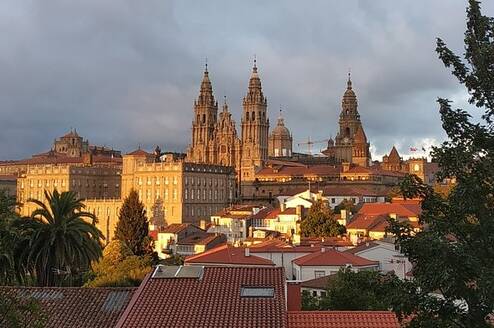 Santiago de Compostela cityscape with dark clouds