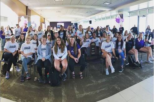 All girls sitting and smiling