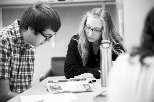 Girl is teaching the guy