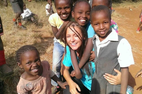 a volunteer working with kids