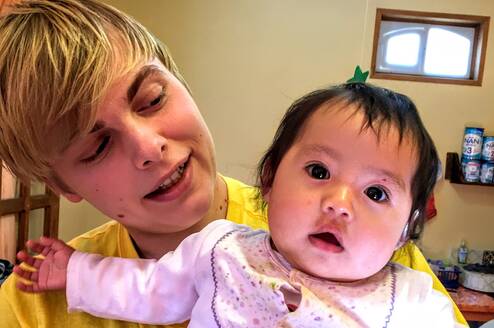Volunteer Christian with Child