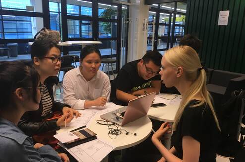Business Interns from internship in china program having a project discussion