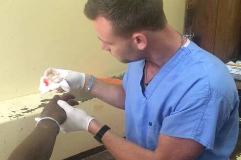 A PA attending to a patient at our placement in Mombasa, Kenya