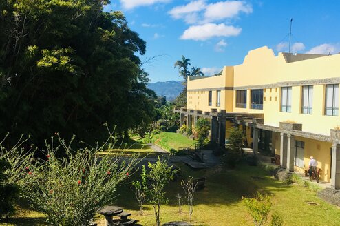 blue skies over a yellow Costa Rican building