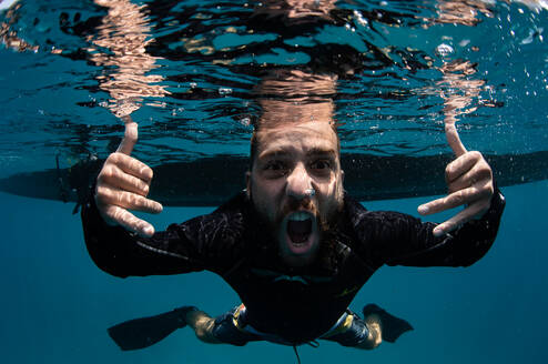 Underwater photo of diver mad about diving