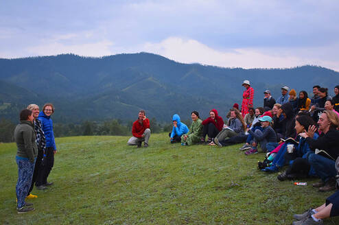 Mongolia Field School 2019 participants gather by the Eg River Science Camp as the course leader briefs them
