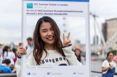UCL Summer School student enjoying the End of Summer Boat Party on the River Thames