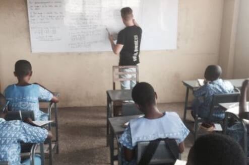 Volunteer given lesson to his students