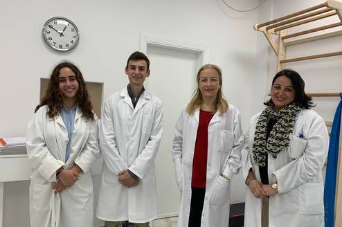 Medical intern learning alongside doctors during an international healthcare internship