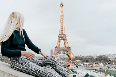 Girl in foreground, with Eiffel Tower in background