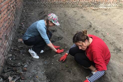 Volunteers in Nepal planting vegetable garden