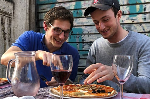 Study abroad students enjoy pizza in Rome