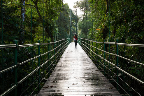 Student on stone bridge at La Selva