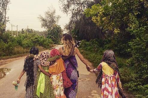 A volunteer with children, PDS Zanzibar, Tanzania