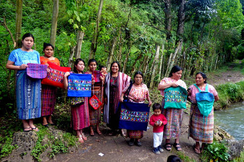 Weavers showing off their hand-woven pillows