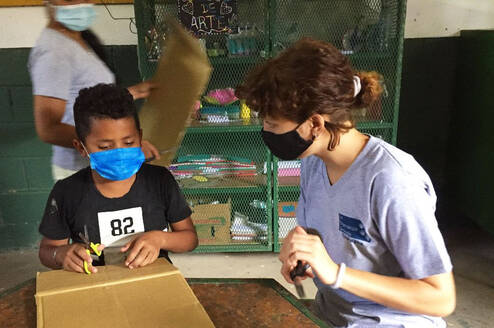 An international volunteer teaching art