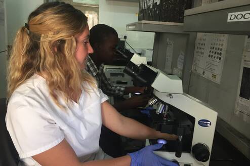 A medical intern working in a lab at a hospital 