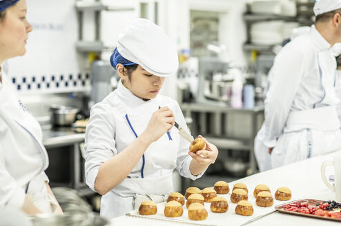 Students in the kitchen during Boulangerie program at Le Cordon Bleu
