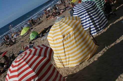 Senic and historical canopies on the Main Beach in Biarritz, France