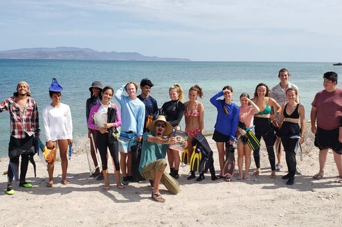 Projects Abroad Volunteer Programs in Mexico Projects Abroad Diving Conservation Team poses in front of crystal blue ocean survey site