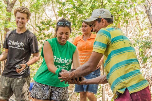 Volunteers and community members work together during the community project