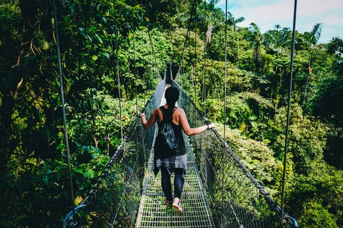 Woman on a bridge in Costa Rica.