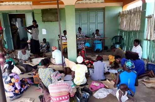 Women and girls in Sewing / Tailoring lessons