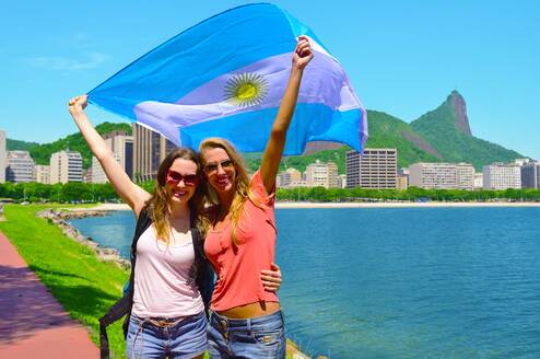 Women holding Argentina's flag